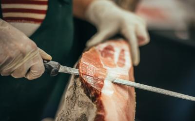 Slicing of italian dry cured ham