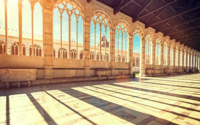 Beautiful arched windows in the building near Pisa tower (Italy)