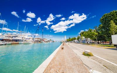 modern buildings, ships, yachts and other boats in Rimini, Italy