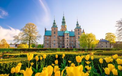 Rosenborg Castle Gardens in Copenhagen, Denmark with blue sky