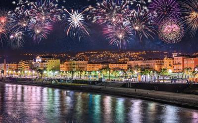 Night view of Nice with fireworks on the black sky, Cote d'Azur, French Riviera, France
