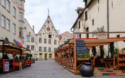 Colorful outdoor seating lines the cobblestone streets, Tallinn