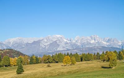Autumn view from the plateau Viote in the Bondone mountains on the glaciated group of the Brenta mountains