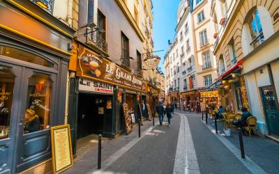 Latin Quarter. Narrow street of Paris among old traditional parisian houses and cafe