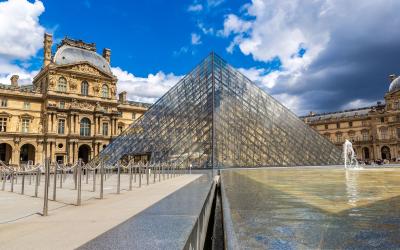 The Louvre and Pyramid   is one of the world's largest museums in Paris in a summer day, France