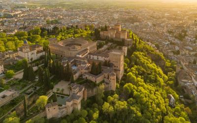 Aerial view of the historic Alhambra palace at sunset in Granada, Andalusia, Spain.